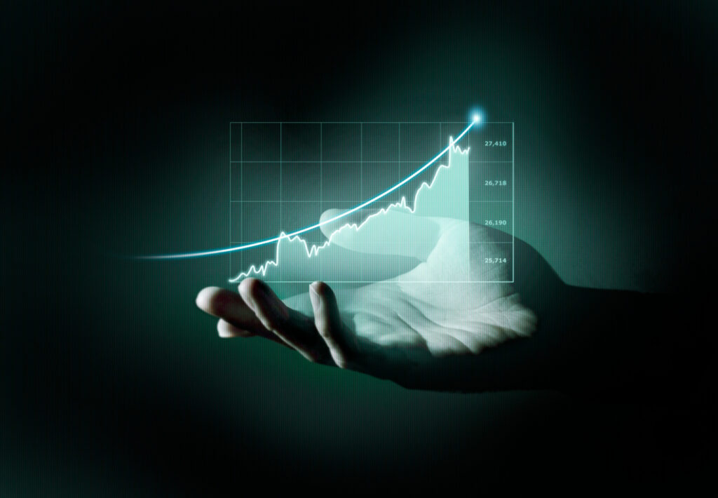 Hand projecting an upward business growth chart.