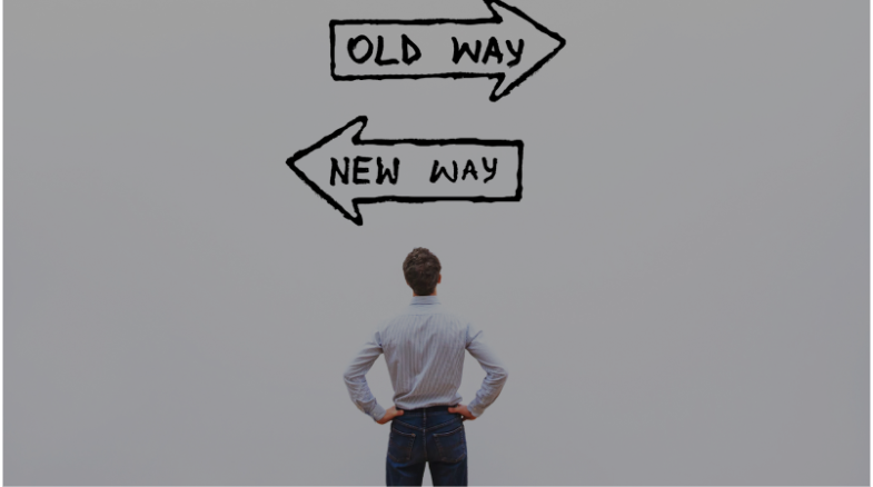 A Man stands before arrows indicating the distinction between traditional web marketing and modern digital marketing approaches.